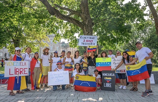 Venezualans attend protest against state repressions by Wilfredor via Wikimedia Commons (Public Domain).